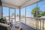 The Second-level Patio Also Includes a Screened-in Porch - Creating the Perfect Space to Enjoy the Outdoors in Any Weather